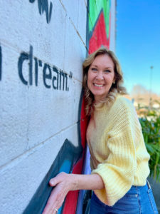 woman happy in life due to knowing Christ as her Savior